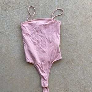 Pink body suit